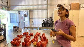 student with tomatoes